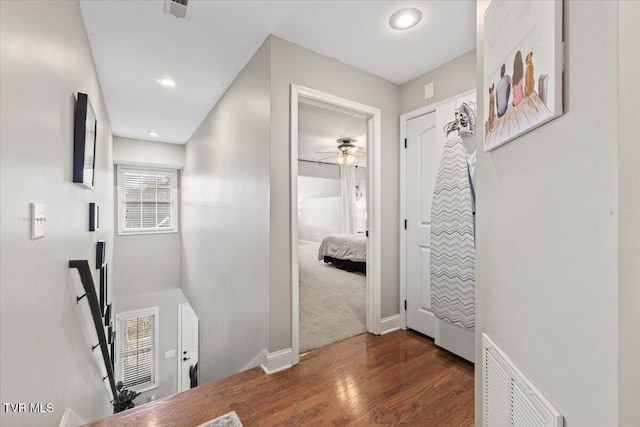 hall with dark wood-type flooring