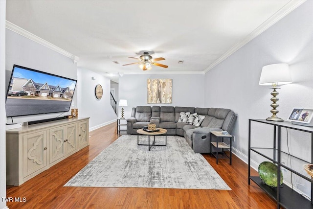 living room with ceiling fan, ornamental molding, and hardwood / wood-style floors