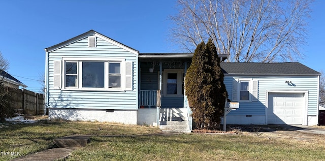 view of front of house with a garage and a front yard