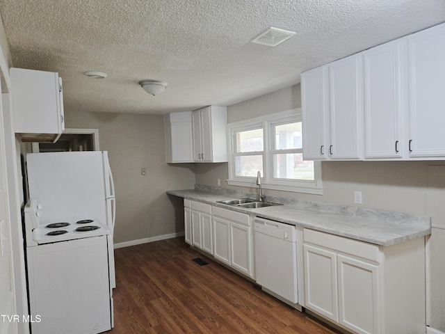 kitchen with sink, white cabinetry, a textured ceiling, dark hardwood / wood-style flooring, and white appliances