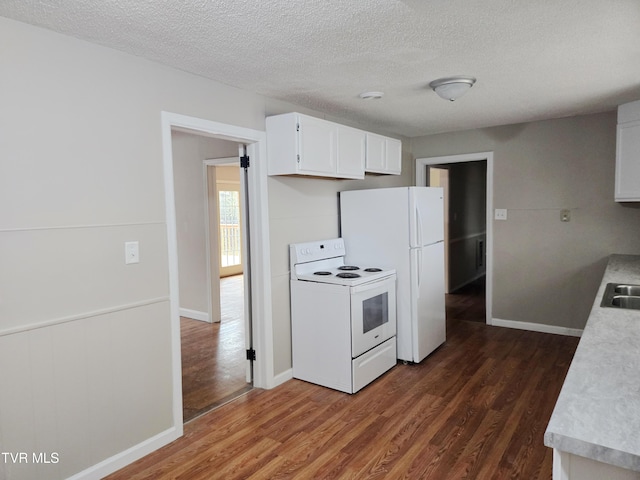 kitchen featuring white cabinetry, white appliances, dark hardwood / wood-style flooring, and a textured ceiling