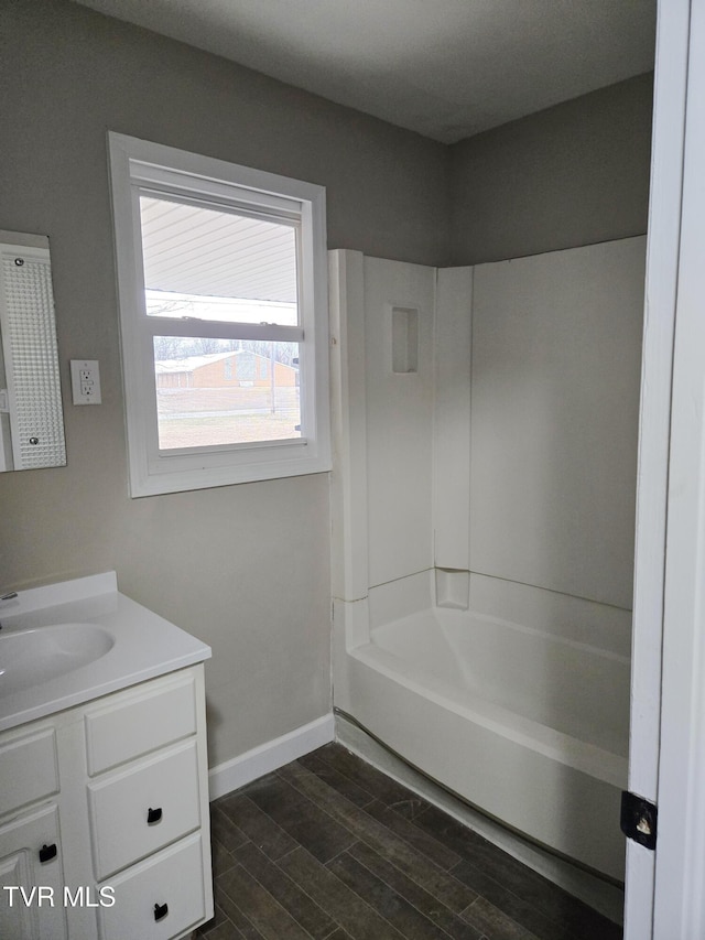 bathroom featuring vanity and bathtub / shower combination