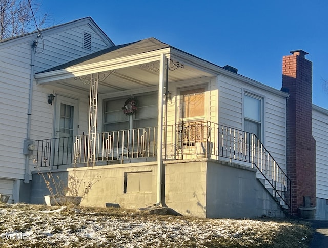 property entrance with covered porch