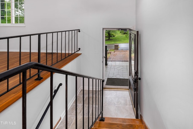 staircase with tile patterned floors