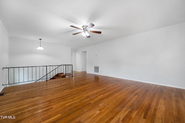 empty room with ceiling fan and hardwood / wood-style flooring