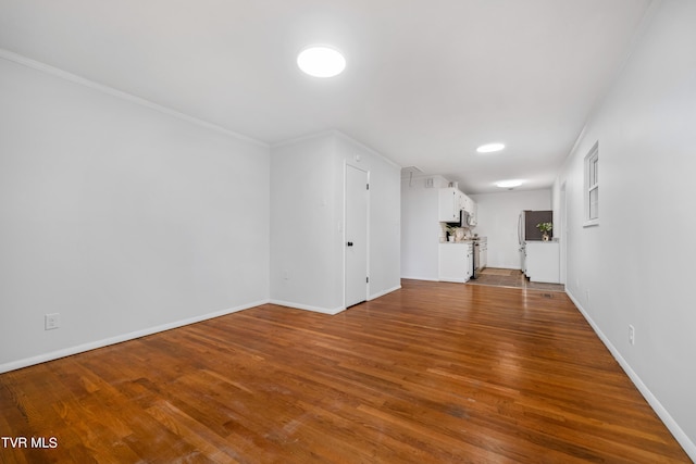 additional living space featuring hardwood / wood-style floors