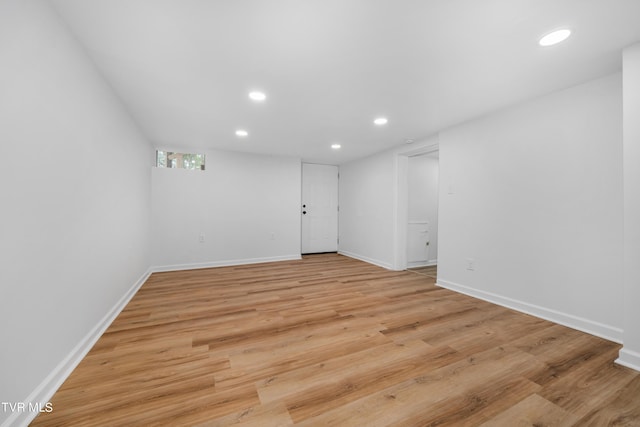 unfurnished room with light wood-type flooring