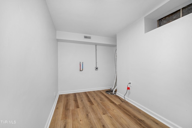 washroom with hardwood / wood-style flooring