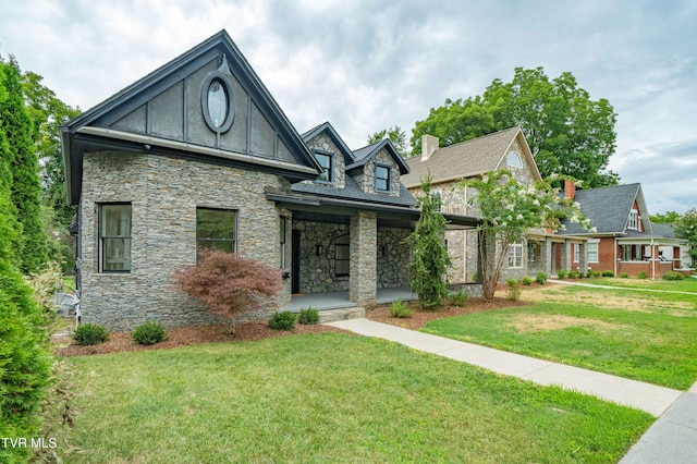 view of front of house featuring a front yard and a porch