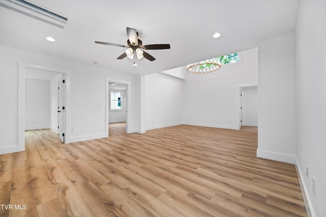 spare room featuring baseboards, ceiling fan, recessed lighting, and light wood-style floors