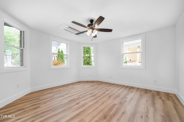 spare room featuring ceiling fan and light hardwood / wood-style flooring