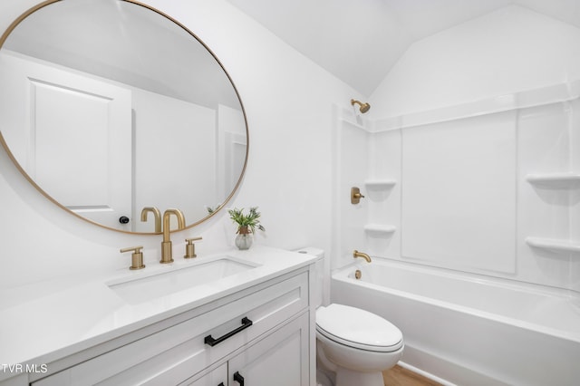 full bath featuring shower / washtub combination, vaulted ceiling, vanity, and toilet