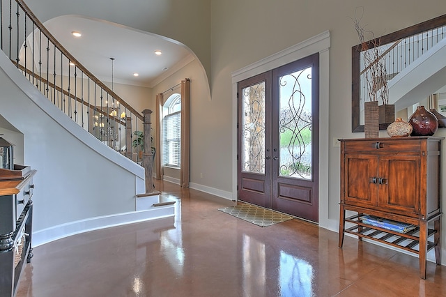 entryway featuring french doors and concrete flooring