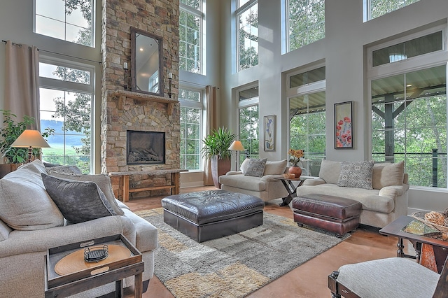 sunroom with a stone fireplace