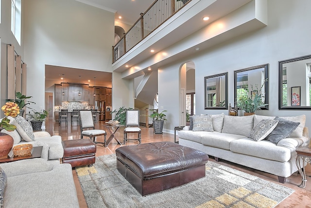 living room featuring a high ceiling