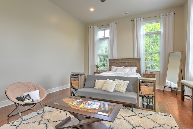 bedroom featuring lofted ceiling and hardwood / wood-style flooring