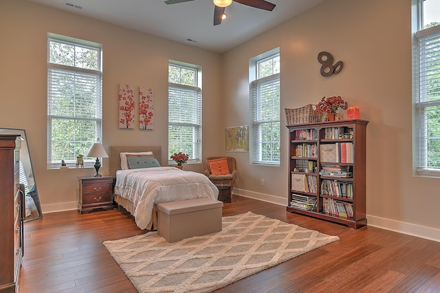 bedroom featuring ceiling fan and dark hardwood / wood-style flooring