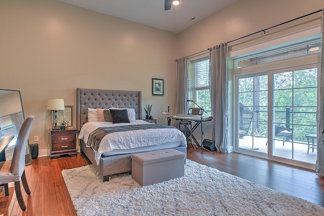 bedroom featuring access to outside, wood-type flooring, and ceiling fan