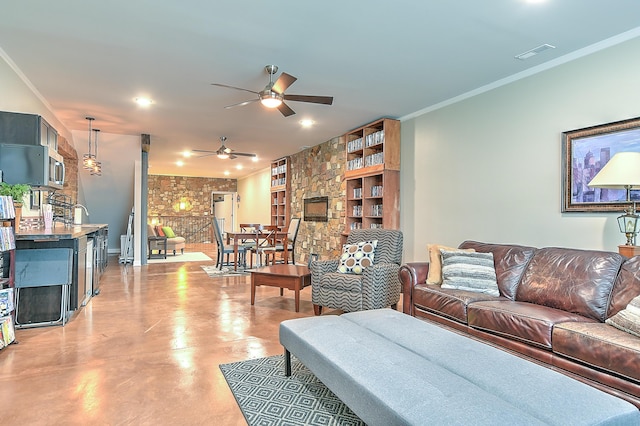 living room featuring ceiling fan, built in features, crown molding, and concrete flooring