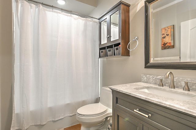 full bathroom with toilet, vanity, and shower / tub combo