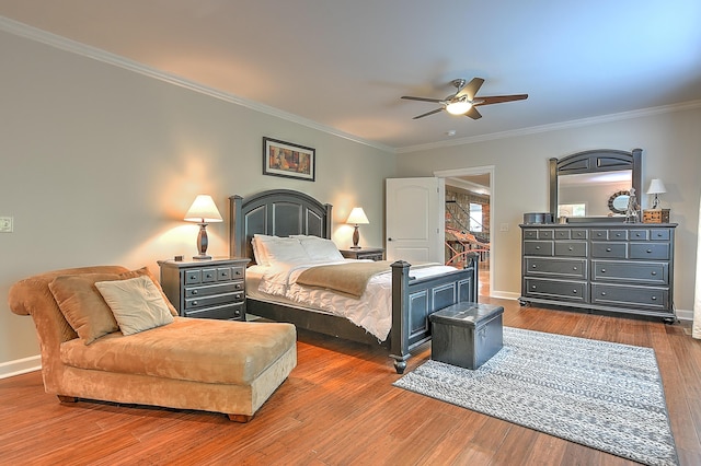 bedroom featuring ceiling fan, dark hardwood / wood-style flooring, and crown molding