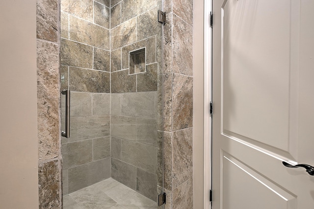 bathroom with an enclosed shower