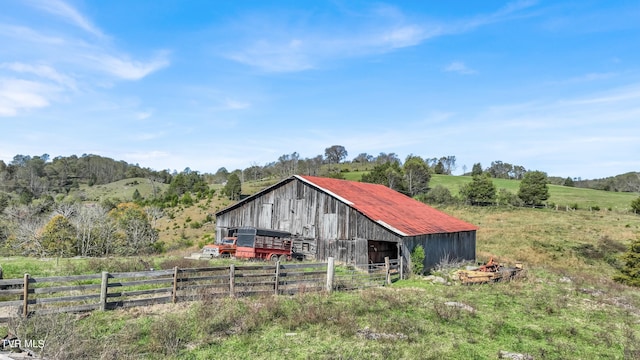 141 Pumplog Holw, Castlewood, VA 24224 - view of outbuilding featuring a rural view