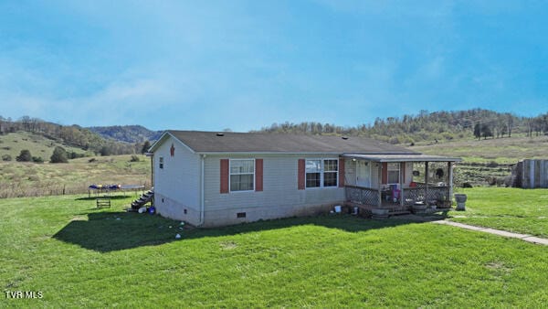 141 Pumplog Holw, Castlewood, VA 24224 - view of front of property featuring a front lawn and a deck with mountain view