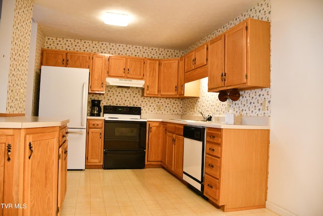 kitchen with tasteful backsplash, sink, and white appliances