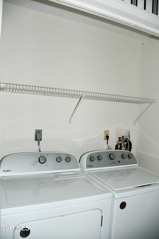 laundry room featuring washing machine and clothes dryer