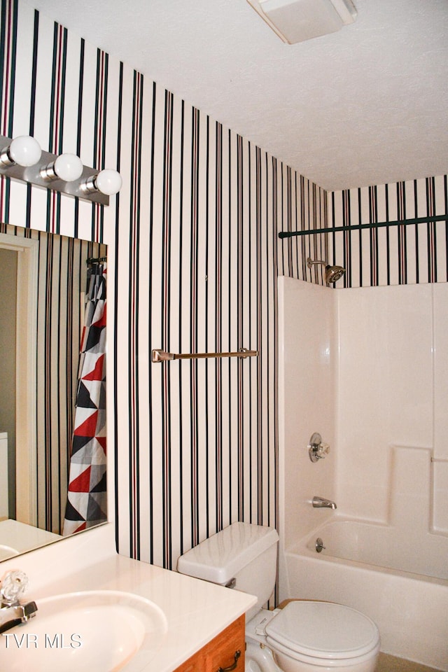 full bathroom featuring vanity, shower / bathtub combination, and toilet