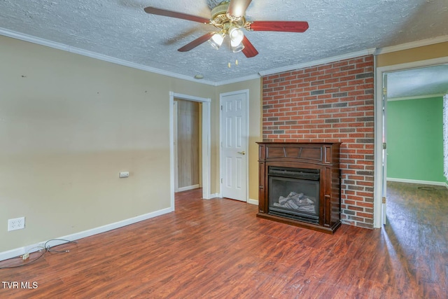 unfurnished living room with crown molding, a textured ceiling, dark hardwood / wood-style floors, and a fireplace