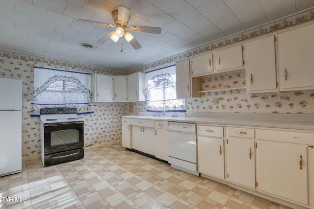 kitchen with sink, ceiling fan, white cabinetry, and white appliances