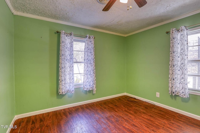 spare room with ceiling fan, hardwood / wood-style floors, crown molding, and a textured ceiling