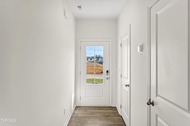 doorway to outside featuring dark hardwood / wood-style floors