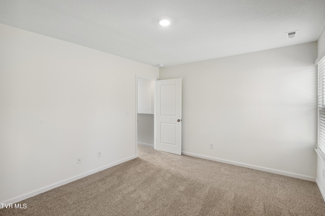 unfurnished room with carpet floors