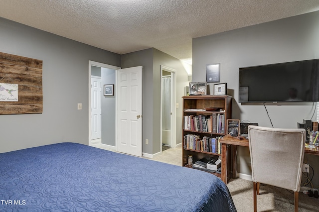 carpeted bedroom featuring a textured ceiling