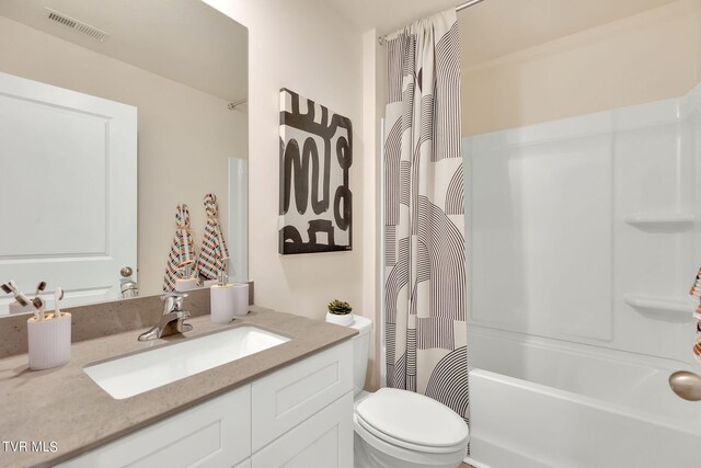 bathroom with shower / bath combo with shower curtain, visible vents, toilet, and vanity