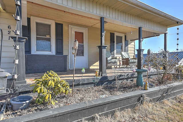 property entrance featuring covered porch