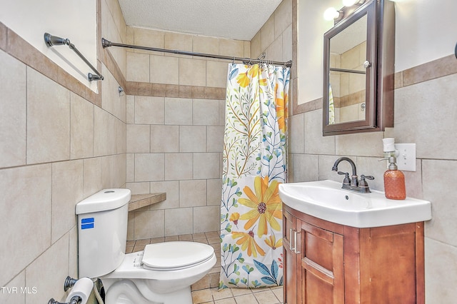 bathroom featuring tile walls, tile patterned flooring, vanity, a textured ceiling, and toilet