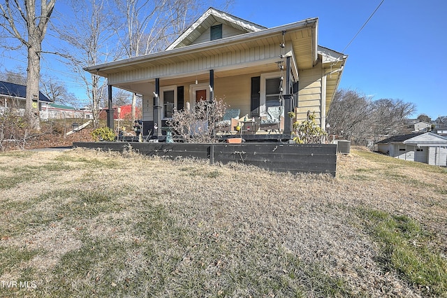 view of front of house with covered porch and central air condition unit