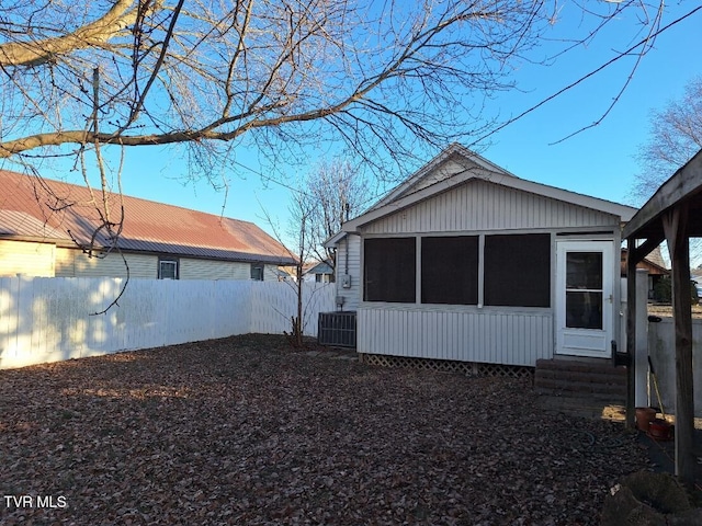 view of home's exterior with central AC