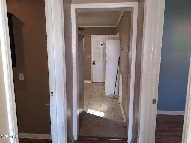 hallway with light tile patterned floors