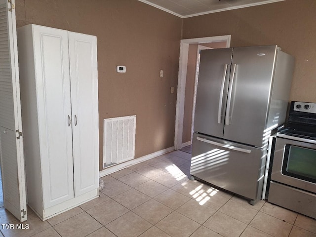 kitchen featuring white cabinetry, light tile patterned floors, and appliances with stainless steel finishes