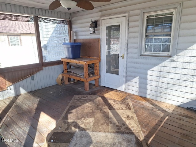 wooden terrace featuring ceiling fan