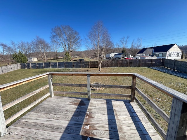 wooden terrace with a yard