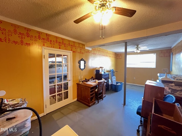 office featuring ceiling fan and a textured ceiling