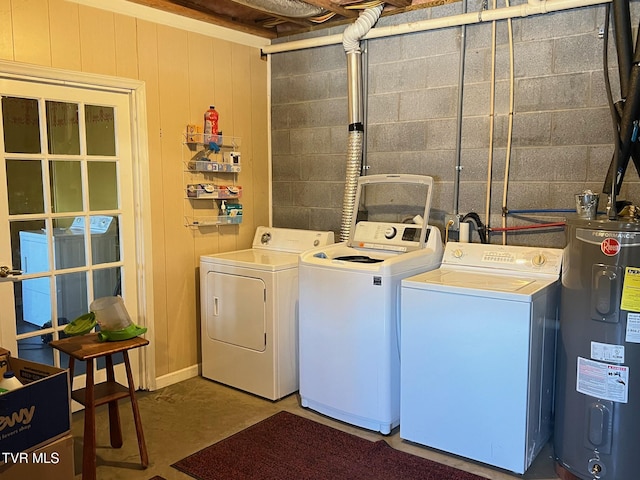 laundry room featuring electric water heater and washing machine and clothes dryer