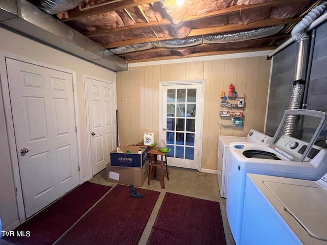 clothes washing area with washer and clothes dryer