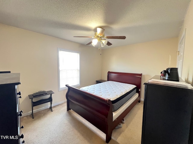 bedroom with light carpet, a textured ceiling, and ceiling fan